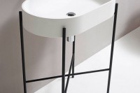 a blackened metal stand for a sink looks ethereal, modern, chic and cool and will add interest to your modern bathroom