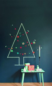 a simple Christmas tree made with tape on the wall, some pompom and star garlands will give a holiday feel to the room