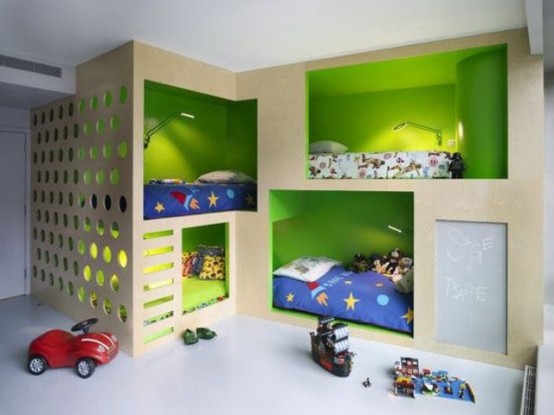 a bright kids' room with built-in box bunk beds with green inside, built-in ladders and built-in sconces