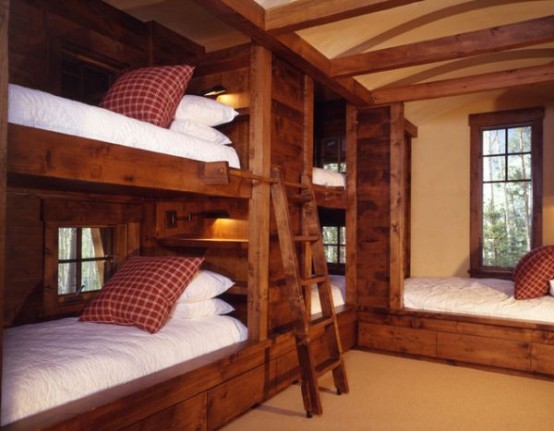 a cozy and welcoming rustic kids' room with built-in bunk beds and an additional one, with ladders can accommodate up to 5 children