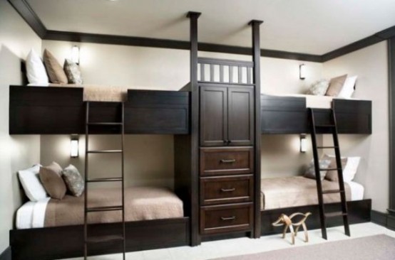 a stylish kids' room with white walls, dark-stained built-in bunk beds with matching ladders and neutral bedding is cool