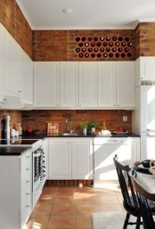 a wine bottle storage built right into a brick wall will save your space and you won’t have to buy a separate unit