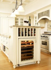 a large wine storage unit built into the kitchen island – a wine cooler and simple shelves for bottles