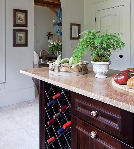 a wine storage unit built into a usual kitchen cabinet is a simple and cool idea if you don't have many bottles