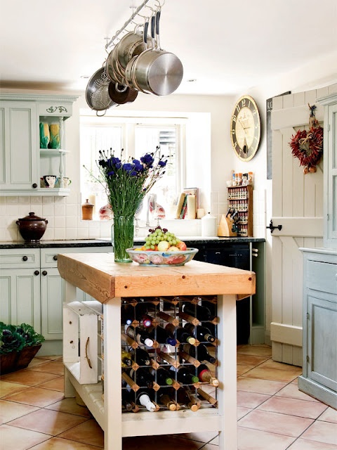 a stylish kitchen island with wine storage in it is a smart and simple idea that saves your floor space