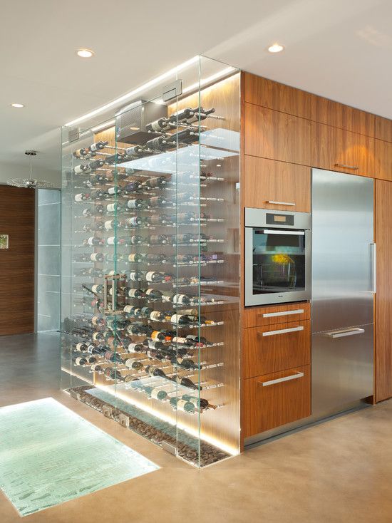 A large clear glass wine cooler as part of the kitchen   put your wine on display and enjoy