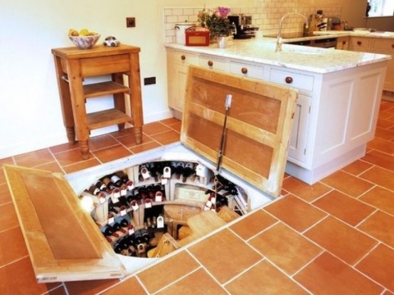 a secret wine cellar built into the kitchen floor is a stylish idea that doesn't take your kitchen space at all