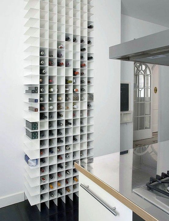 A minimalist wall mounted storage unit for bottles is a stylish idea and a space saving one