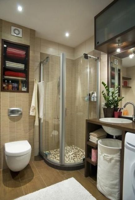A modern small bathroom in sandy shades, built in storage space, an open vanity and a shower