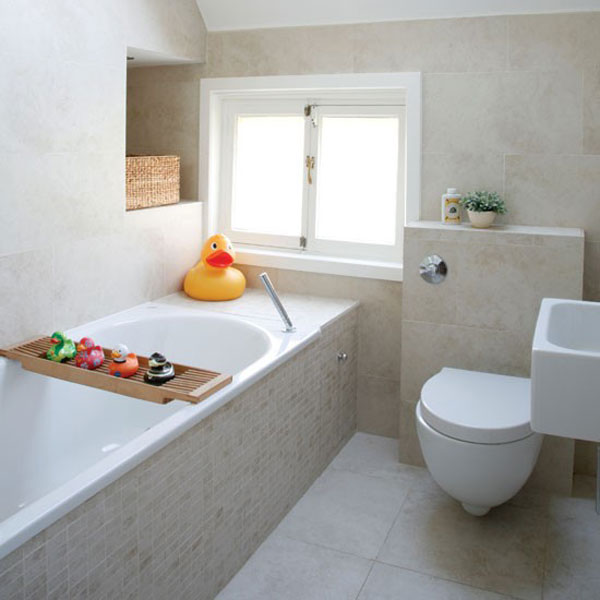 A neutral contemporary bathroom with built in storage space, a window for natural light and a comfy tub