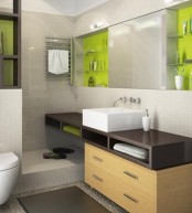 a bright contemporary bathroom with neutral tiles, neon touches, a floating vanity and a large mirror with storage