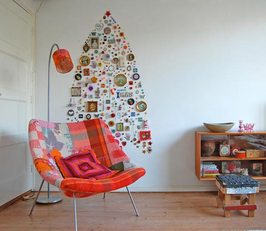 Alternative Christmass Tree Of Different Things Hung On A Wall (via apartmenttherapy)