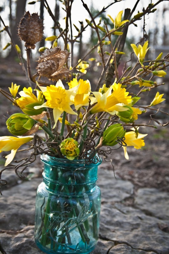 a blue jar with daffodils and dried branches is a pretty spring decoration for spring, it's easy to compose