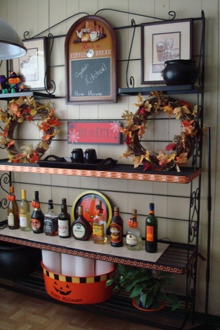 Fall wreaths of vine with bright fall leaves are simple fall inspired decorations for your kitchen