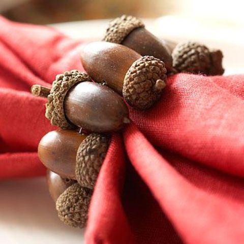 a fall napkin ring made of acorns is a cool idea to style your fall party tablescape