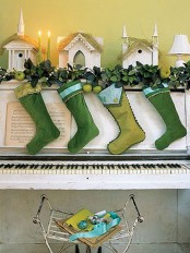lovely way to decorate a mantel with green stockings