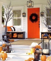 a rustic halloween front porch decor