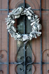 a bold metallic skeleton wreath is a gorgeous statement for Halloween, and you can DIY one easily