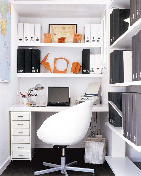 A small working nook with lots of open shelves, a small built in desk, a white chair and a basket is a cool nook for working