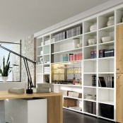 a whiet home office with an oversized open storage unit, a stained and white desk, a potted plant is a cool working space with lots of storage
