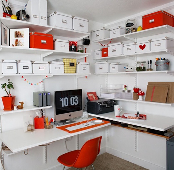 A working corner in red and white, with open corner shelves, a wall mounted corner desk and a red chair is nice for working here
