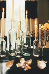 vintage bottles as candleholders can be used for creatign a lovely and spiritual centerpiece that will create a mood and an intimate feel