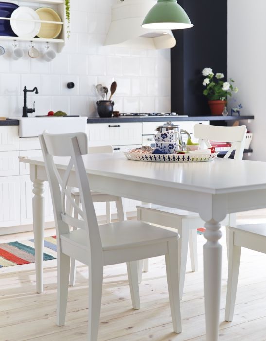 Change the legs and finish the table with glossy white paint for a modern dining room.
