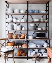 an oversized open storage piece with several shelves is a cool idea for any kitchen and it will accommodate a lot of stuff
