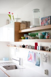 upper cabinets united with some open shelves are great for storing everything you want and they won’t look as bulky as just uppers