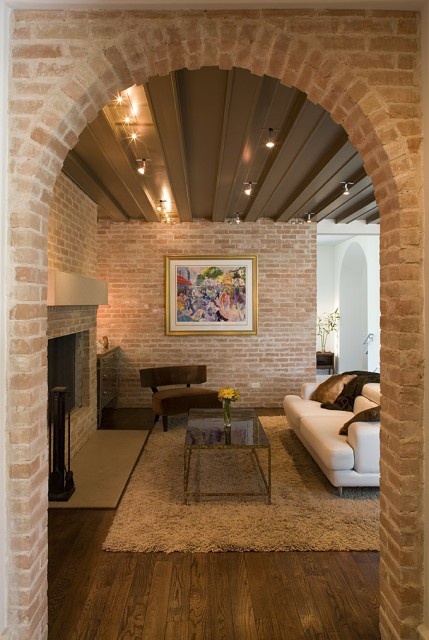 red brick walls were whitewashed to achieve a more neutral and muted look for the space
