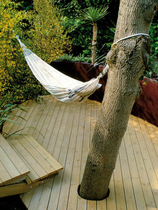 a small and simple deck with a hammock and steps - who needs more to relax