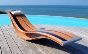 a statement contemporary plywood lounger with a very smooth shape and with some metal touches is a cool idea for a minimalist space