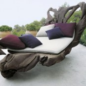 a unique dark wood lounger made of a single piece of driftwood looks abolutely natural, as if you’ve brought a piece of driftwood to your outdoor space