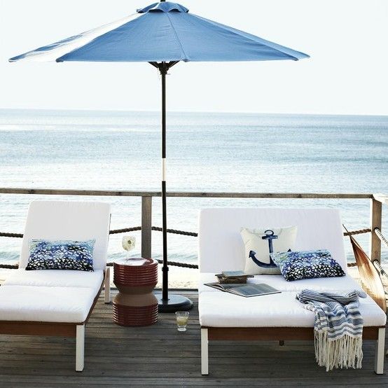 elegant wood and plywood lounger and double lounger with white upholstery are perfect for a contemporary coastal or beach space
