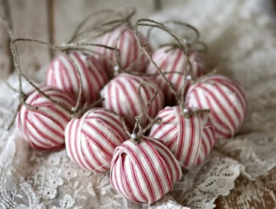 rustic Christmas ornaments wrapped with red and white stripes, with twine and pearls