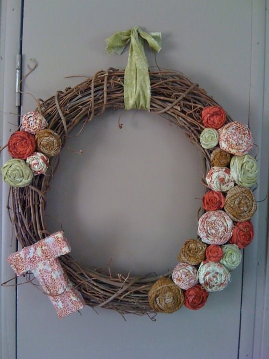 a vine Christmas wreath with colorful fabric flowers and a letter is a nice DIY decoration for Christmas