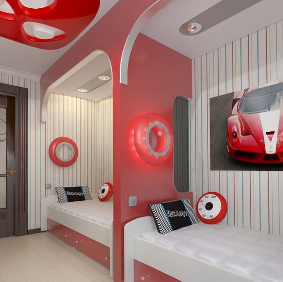 a stylish modern teen boy bedroom with striped walls, beds in niches, storage drawers and bright touches of red