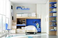 a bold modern teen shared bedroom with white walls and furniture, a glazed wall, bright blue touches and plenty of storage space
