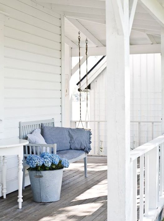 White is the best color to make your front porch looks bigger than it is.