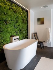 a living moss wall in your bathroom will make it feel outdoorsy during any season of the year, and it’s a trendy decor feature