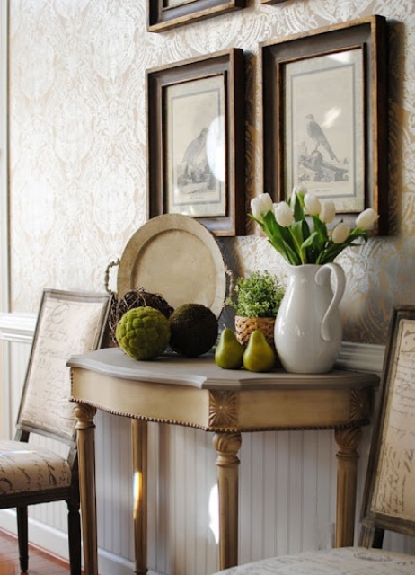 moss balls on console tables are right what you need for adding a spring feel to the space