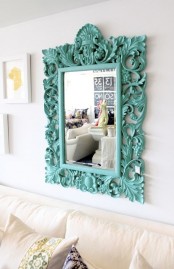 a mirror in a large ornated frame painted turquoise will add color to your space and will make it more eye-catchy and interesting