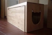 a wooden cabinet with a drawer and a cat head-shaped entrance is easy to use and easy to clean