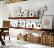 a farmhouse space with thick wooden ledges that display artworks and photos – this is a cool idea that perfectly matches the decor of the space