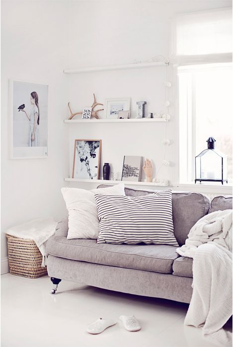 an airy Scandinavian space with ledges that are used for displaying art, vases, monograms, antlers and other stuff