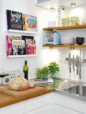 attach some ledges in your kitchen to display your cooking books and have them always at hand