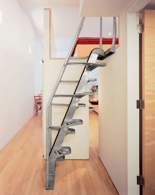 This loft stair is made by Lapeyre Stair. It is very cost-effective and occupies very little space. You can come down without holding the rail.


