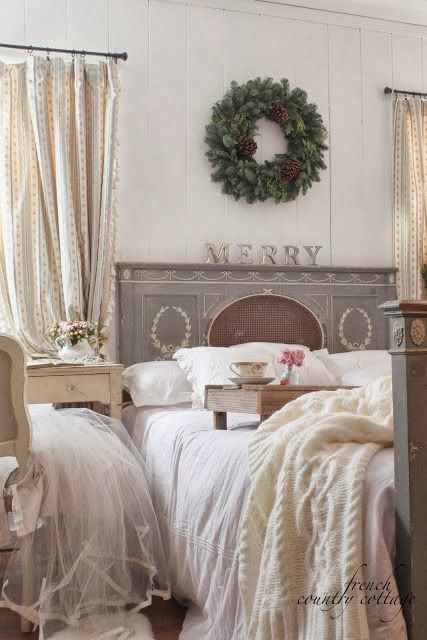 Knit blankts and a single evergreen and pinecone wreath on the wall make your bedroom more holiday like
