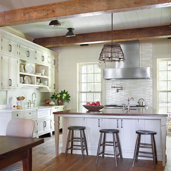 In contemporary farmhouse kitchens you could combine timeless cabinets, exposed wooden beams and modern looking stainless steel appliances.