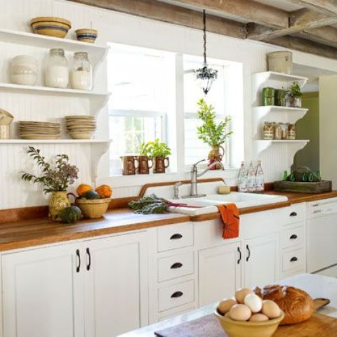 Exposed beams on a farmhouse kitchen  works quite good with white cabinetry and shelves.